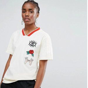 EMBELLISHED ARTS OVERSIZED T-SHIRT WITH BADGES - BLACK